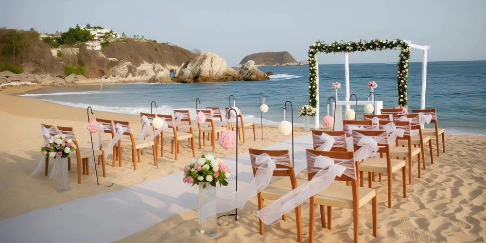 Barracuda Beach wedding ceremony setup with ocean views at Dreams Huatulco Resort & Spa
