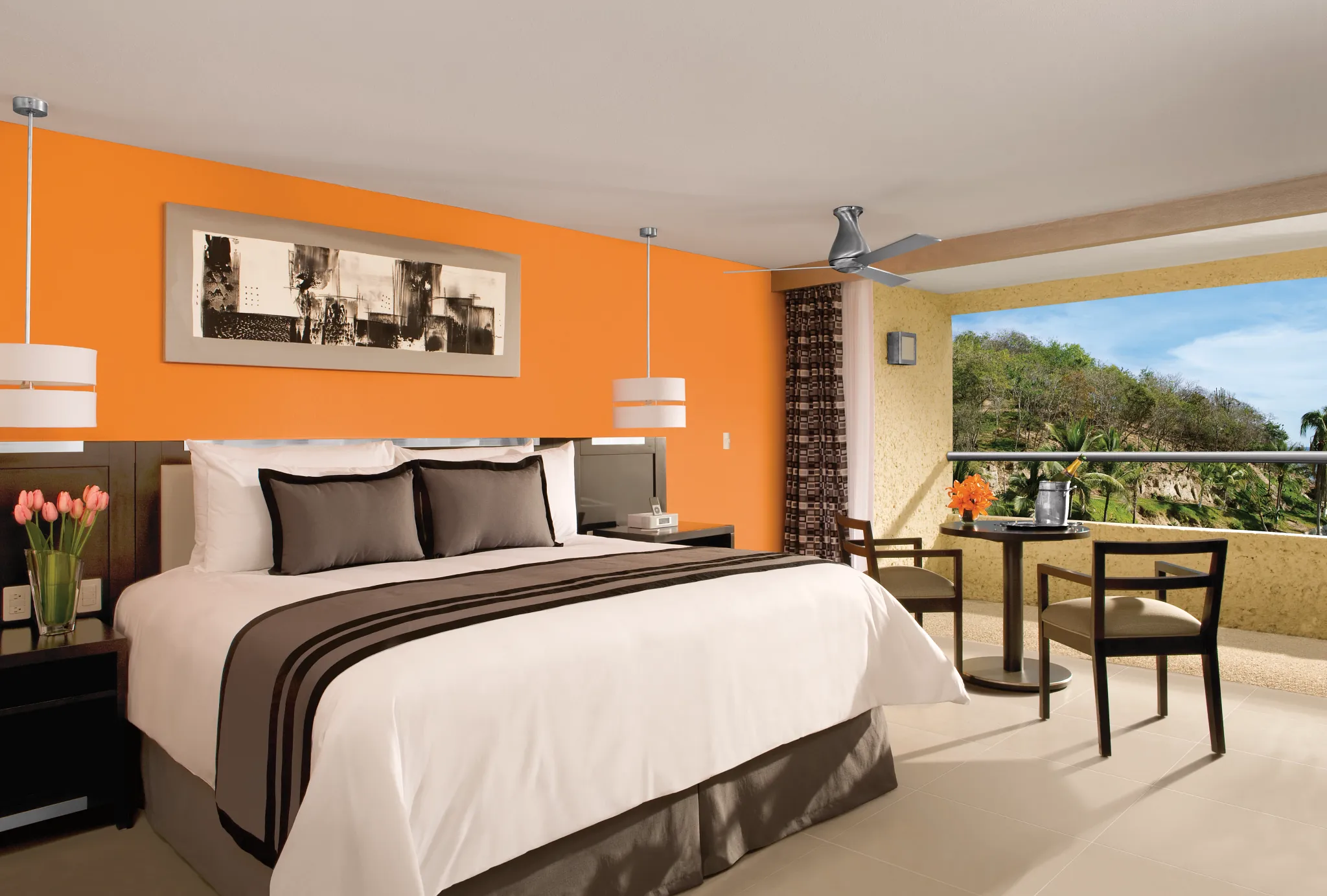 Deluxe Tropical View room at Dreams Huatulco Resort & Spa with king bed, modern amenities, and views of lush tropical gardens.