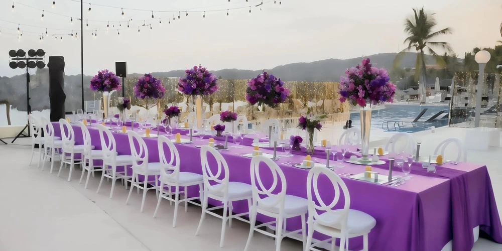 Gazebo Terrace wedding reception with elegant purple décor and pool views at Dreams Huatulco Resort & Spa
