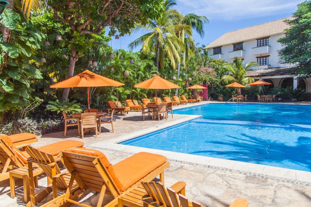 Hotel Villa Blanca Huatulco boutique hotel with intimate setting, tropical gardens, and authentic Oaxacan charm near Santa Cruz Bay.