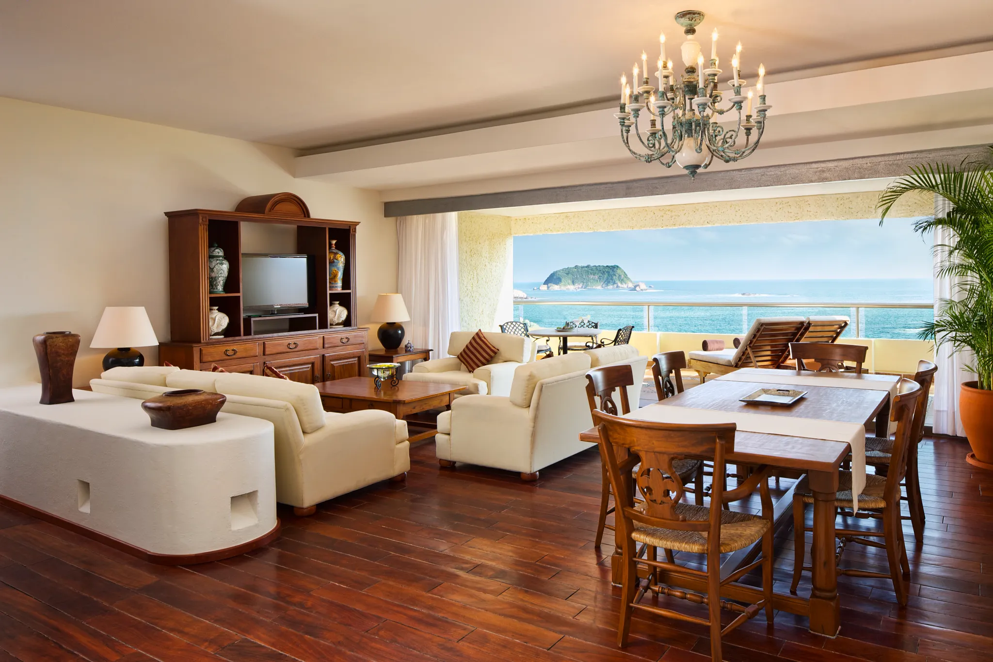 Preferred Club Presidential Suite living and dining area with oceanfront terrace at Dreams Huatulco Resort & Spa.