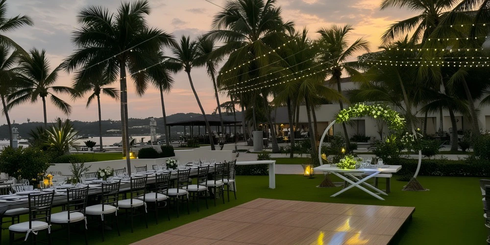 Principal Garden wedding reception setup with palm trees and sunset lighting at Dreams Huatulco Resort & Spa